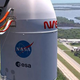 NASA’s old-school ‘worm’ logo is plastered across the SLS rocket alongside its modern logo and the European Space Agency logo.